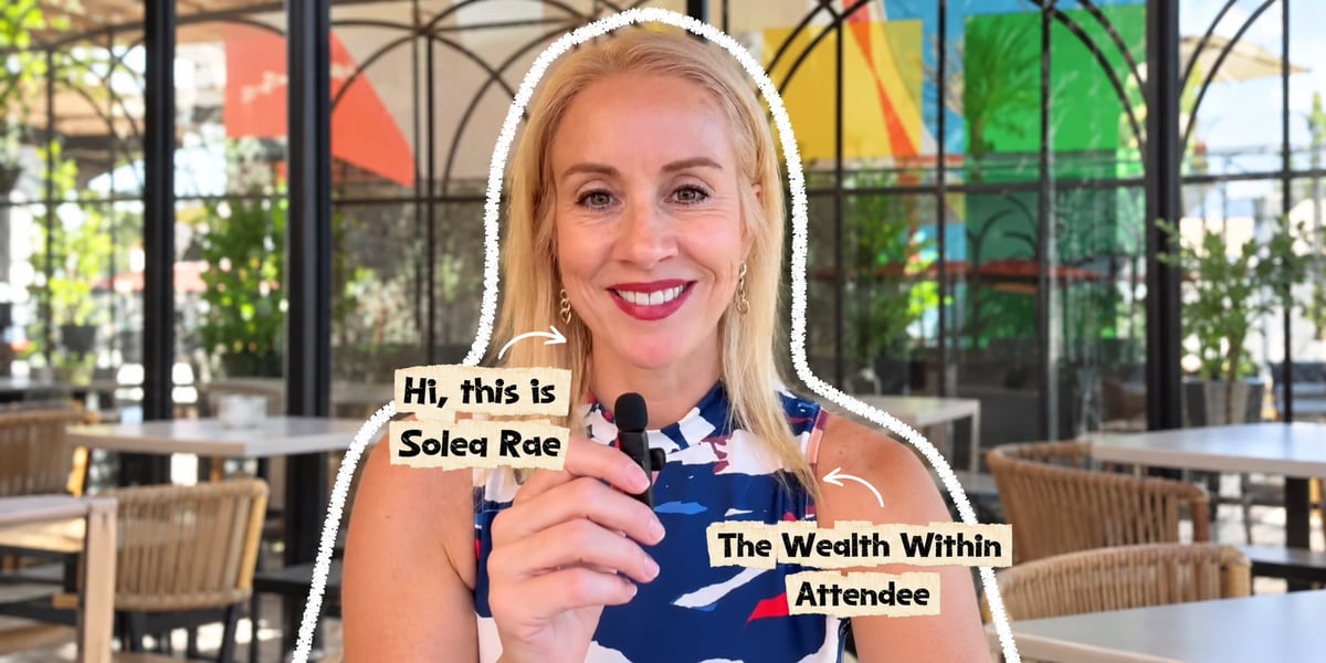 Woman with blonde hair holding name badges for Solea Roe and The Wealth Within Attendee at an outdoor venue